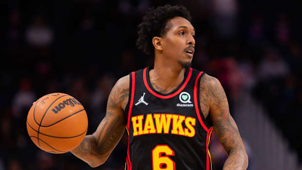 Hawks guard Lou Williams dribbles the ball during a game in 2022.